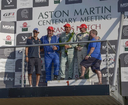 Robert Rawe, Nick Naismith and Paul Drayson enjoy the taste of Champagne after a thrilling race